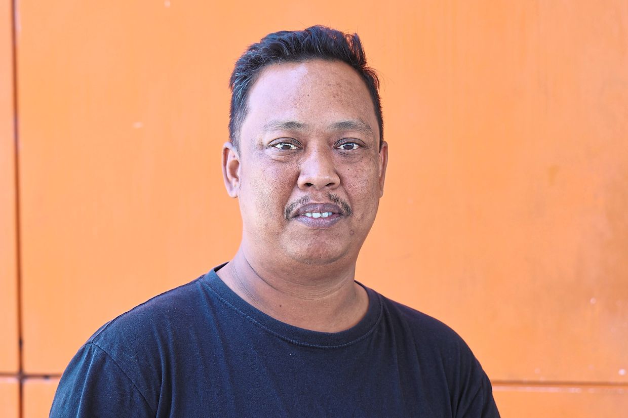 Lorry driver Mohd Fauzi Jaafar discussing his inability to absorb higher fuel costs.