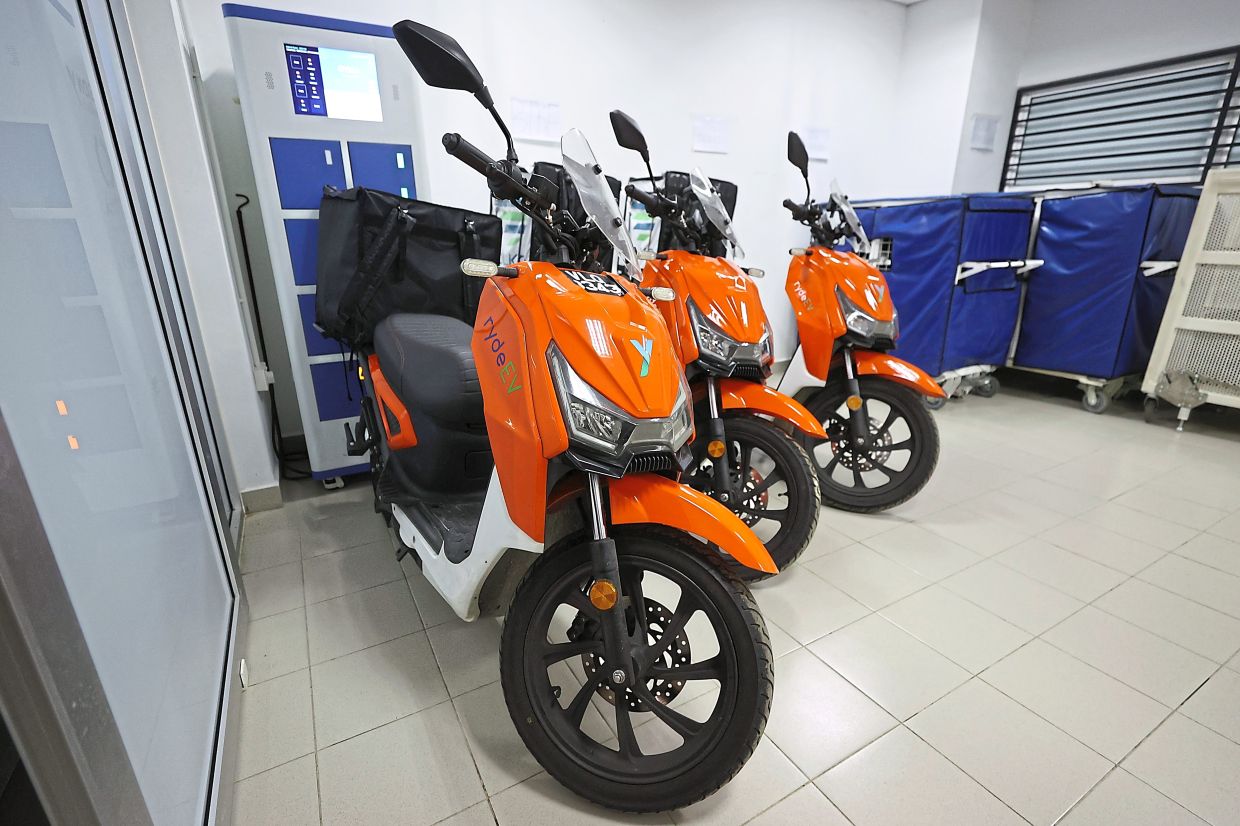 Electric motorcycles waiting for last-mile delivery at Ara Damansara LRT station
